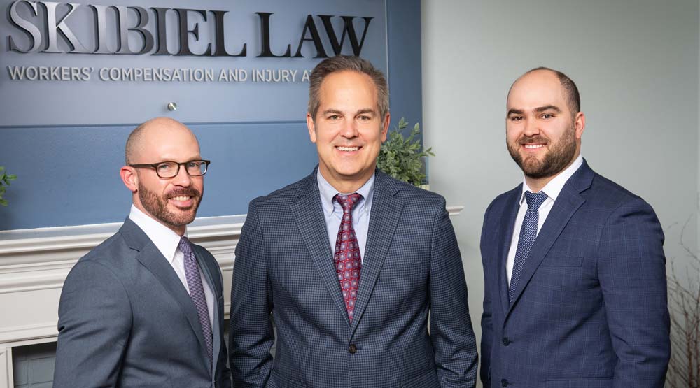 group photo of attorneys Joshua Landers, Mark Skibiel and Andrew Skibiel